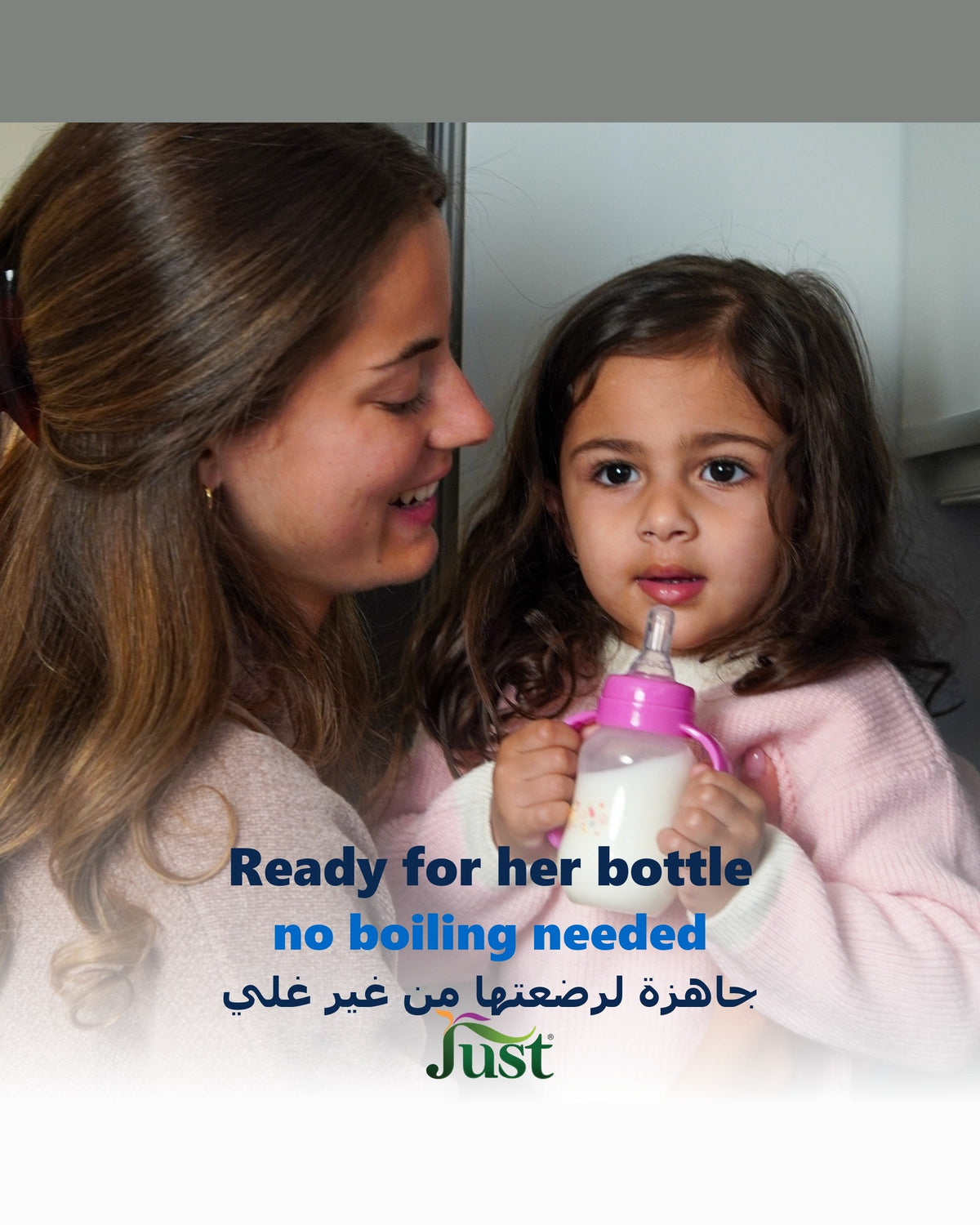 Mother and daughter with a baby bottle made with Just Purified Water, no boiling needed